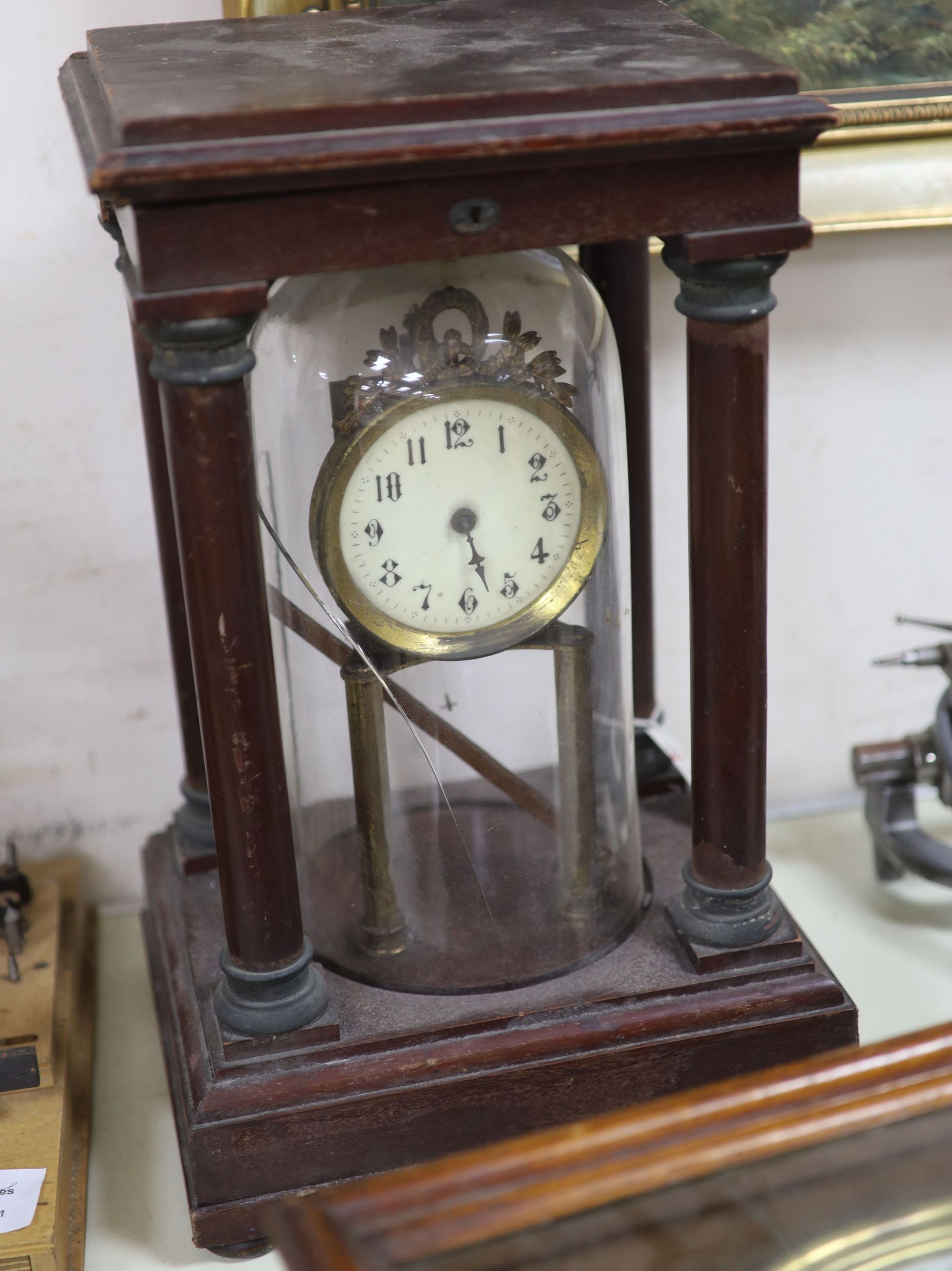 An early 20th century mahogany and brass electric mantel clock, with integral glass dome, incomplete, overall height 40cm